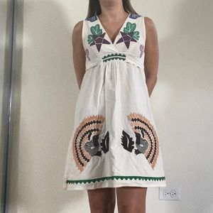 White dress with embroidered details